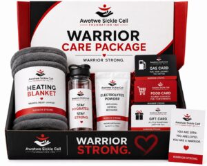 Open Warrior Care Package box containing a heating blanket, electrolytes powder, food card, gas card, gift card, and an encouraging note card resting on the edge of the box.